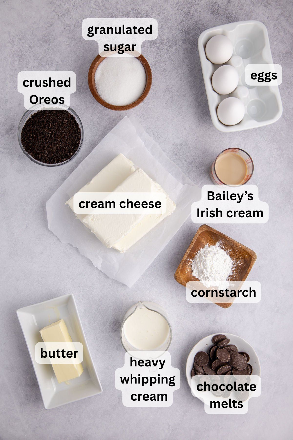 Ingredients to make this Irish cream cheesecake on a table.