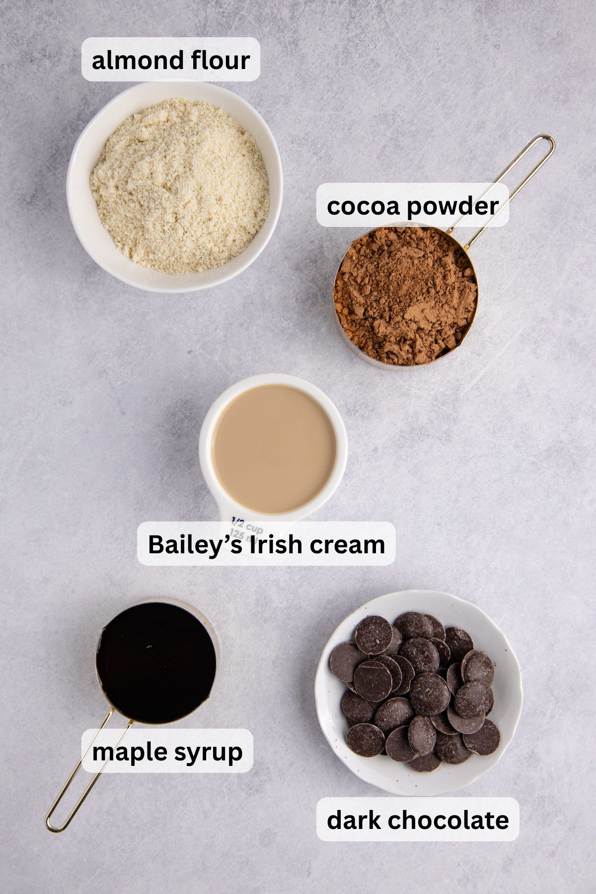 Ingredients to make these truffles in bowls on a table.