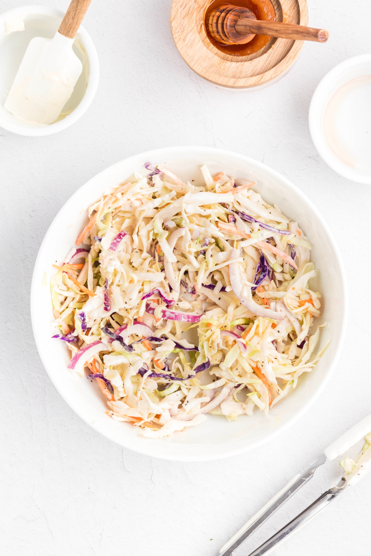 Coleslaw prepared in a bowl.