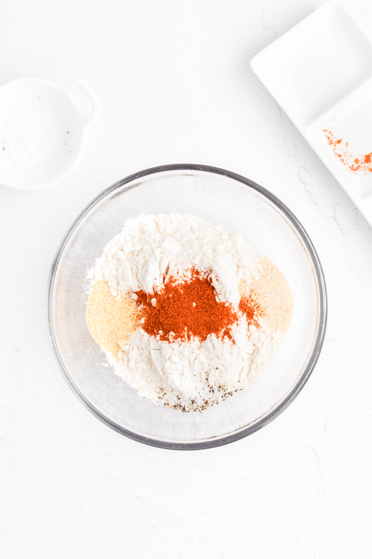 Spices and flour in a bowl.