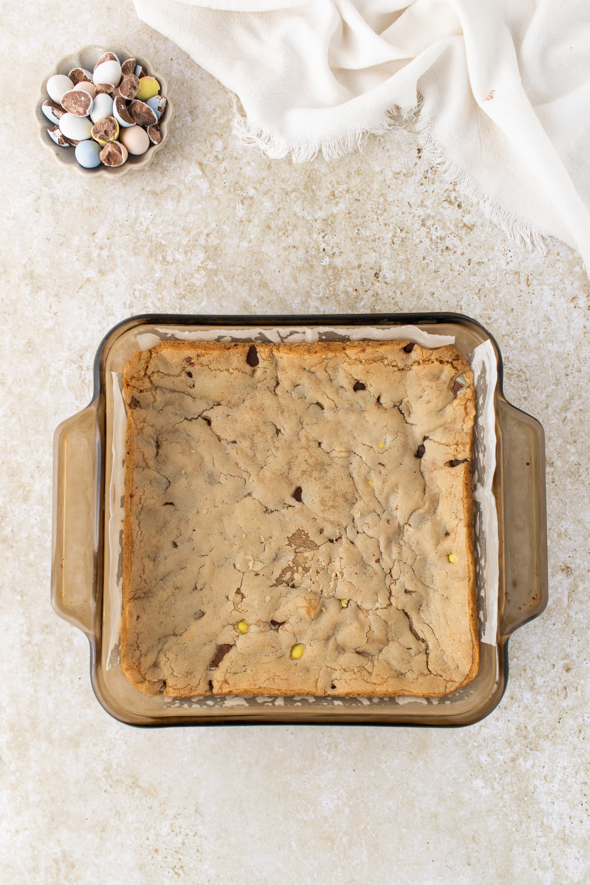The cookie dough cooked in a baking dish.
