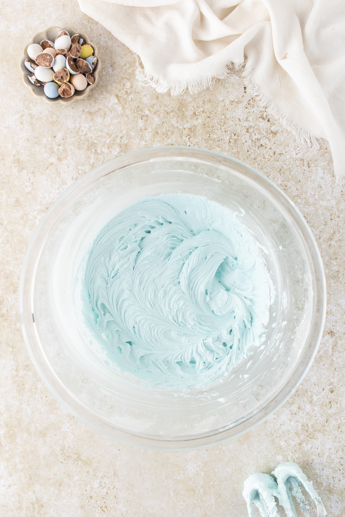 The frosting ingredients combined in a mixing bowl. 