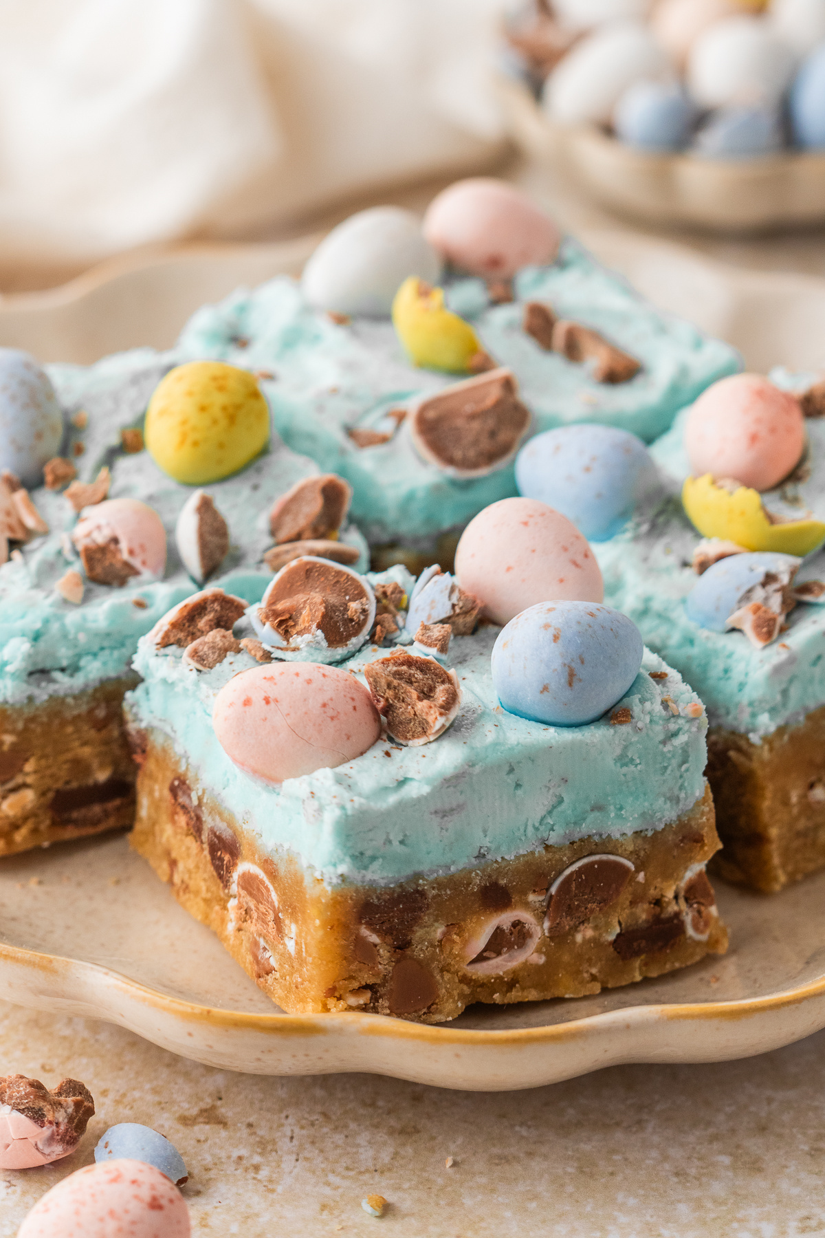 Cadbury egg cookie bar squares cut up on a plate.