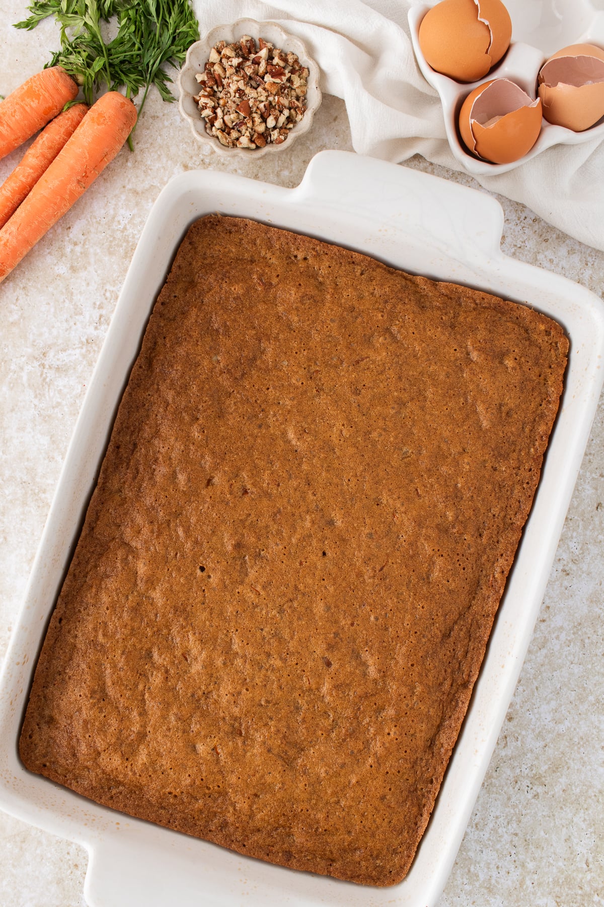The carrot cake baked in the baking sheet.