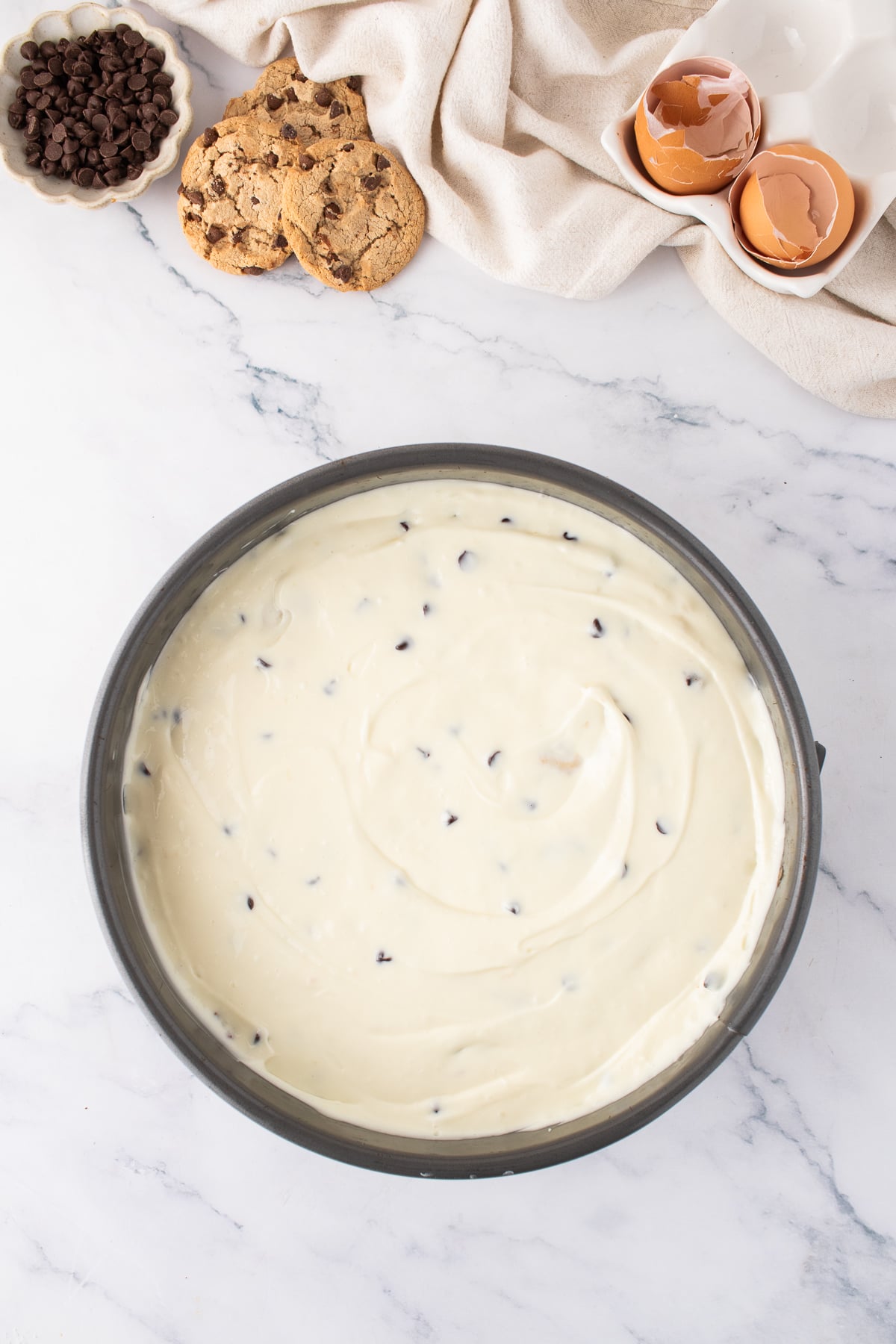 The cheesecake mixture added to the cookie crust.