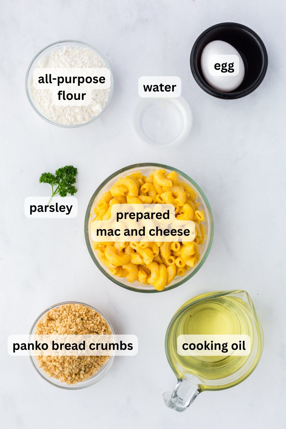 Ingredients for making fried mac and cheese balls in bowls.