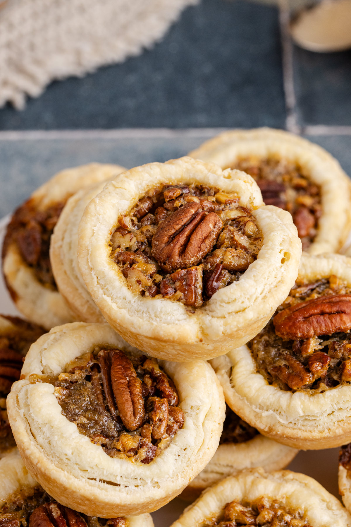 A pile of mini pies on a plate.