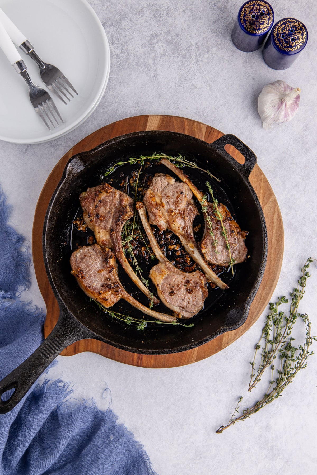 Lamb chops flipped to brown the other side.