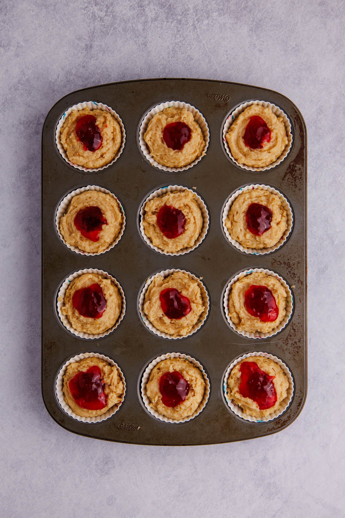 Strawberry jam added inside of the muffin batter.