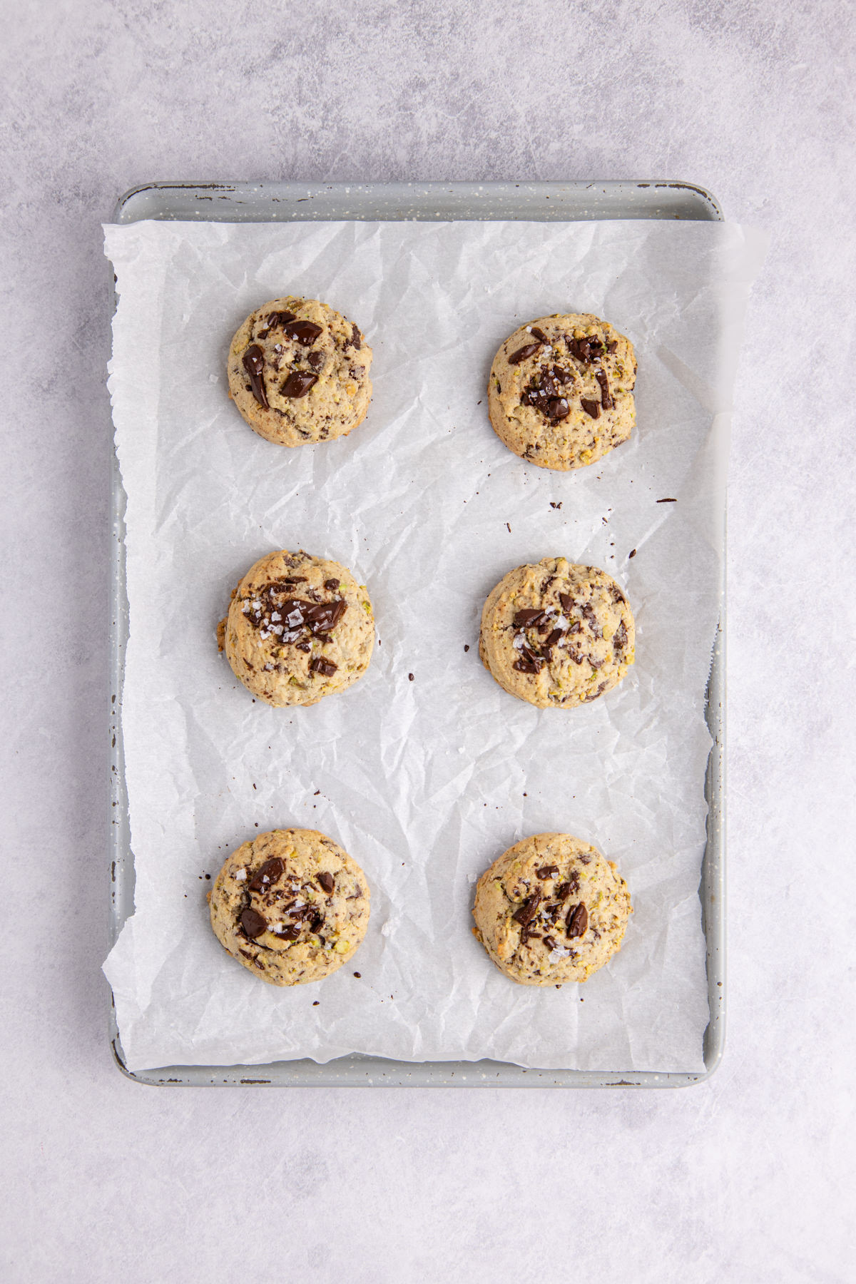 Cookies cooked and cooling on the sheet pan.
