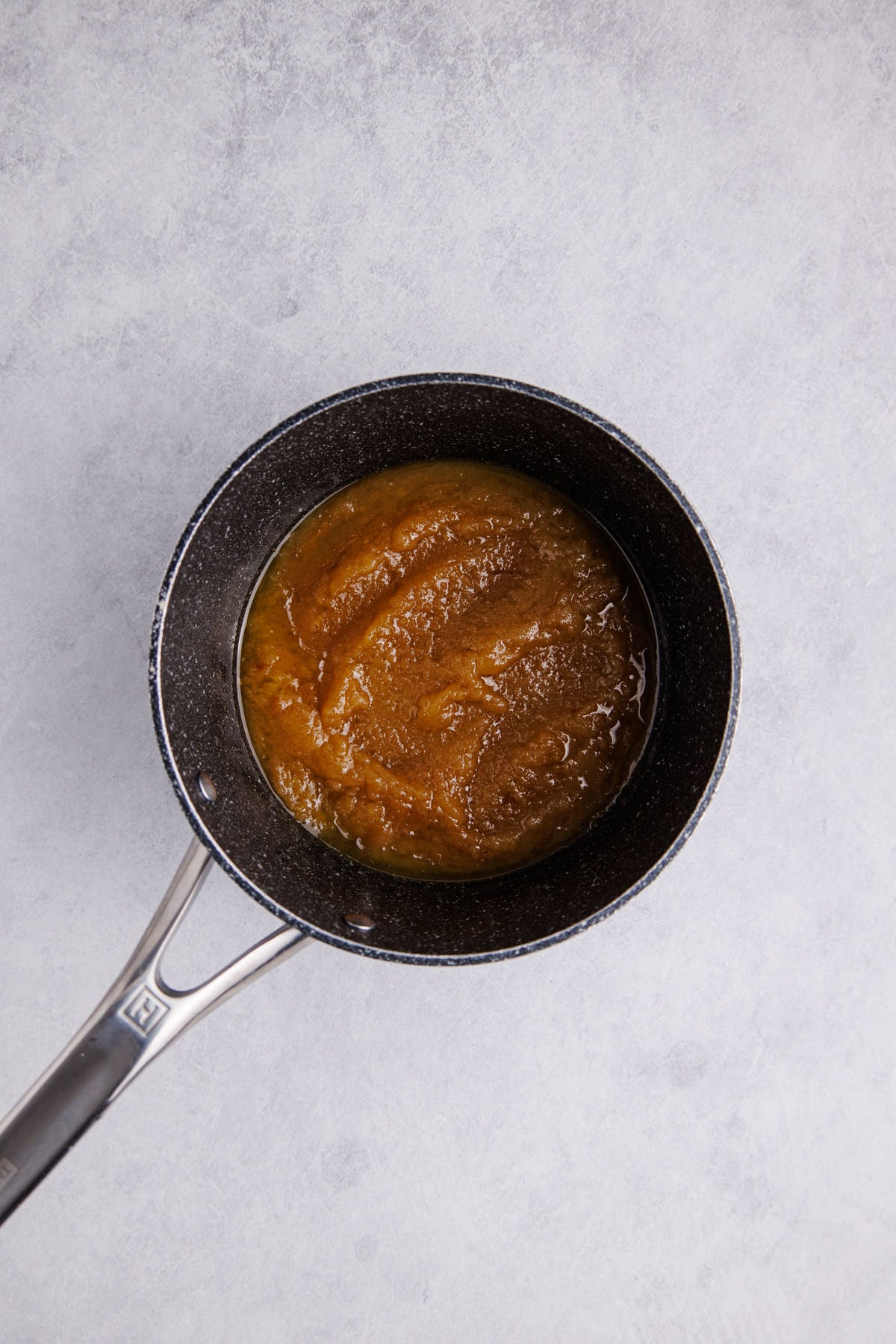 Butter and brown sugar melting in a pot.