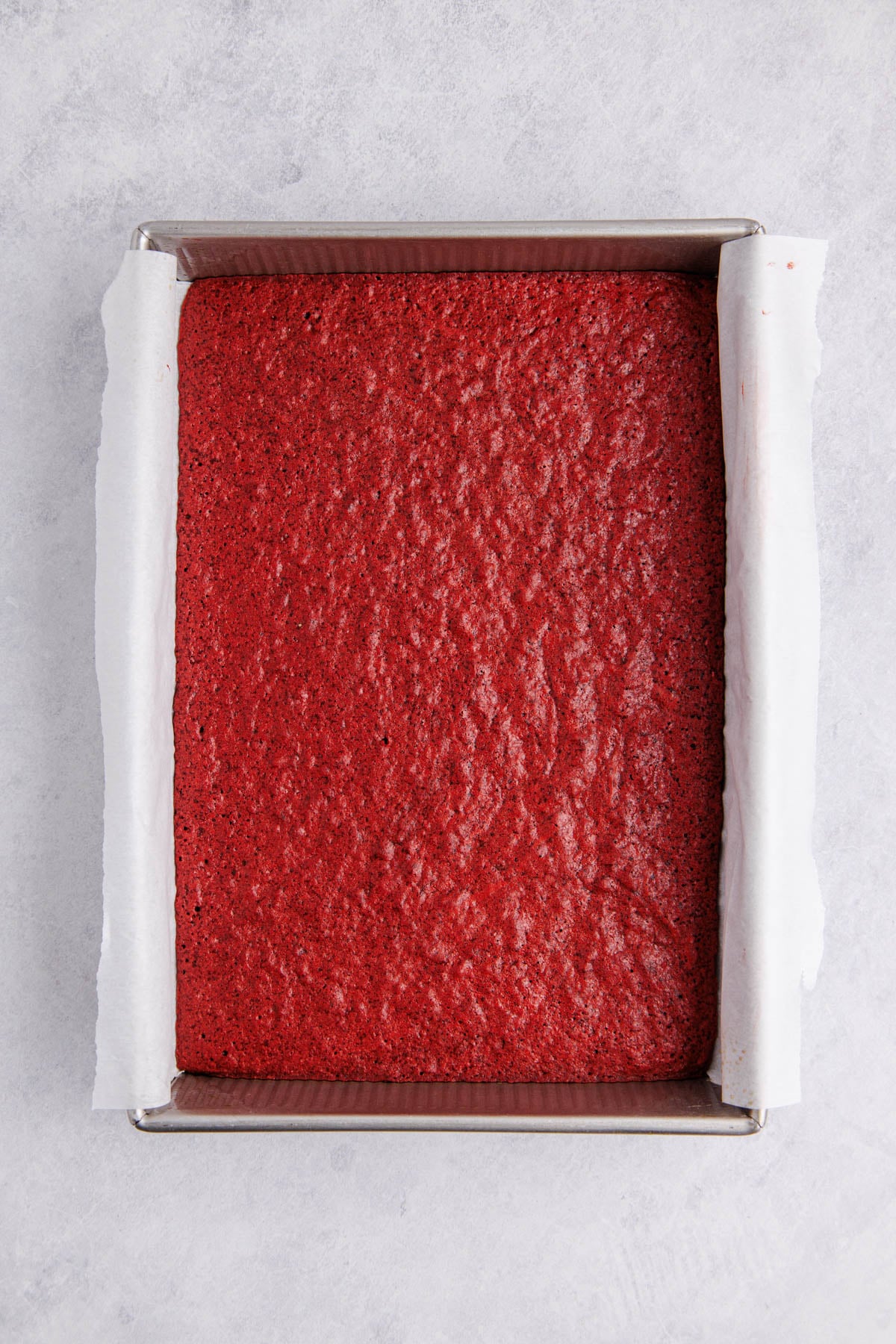 The brownie cooked and cooling in the baking pan.