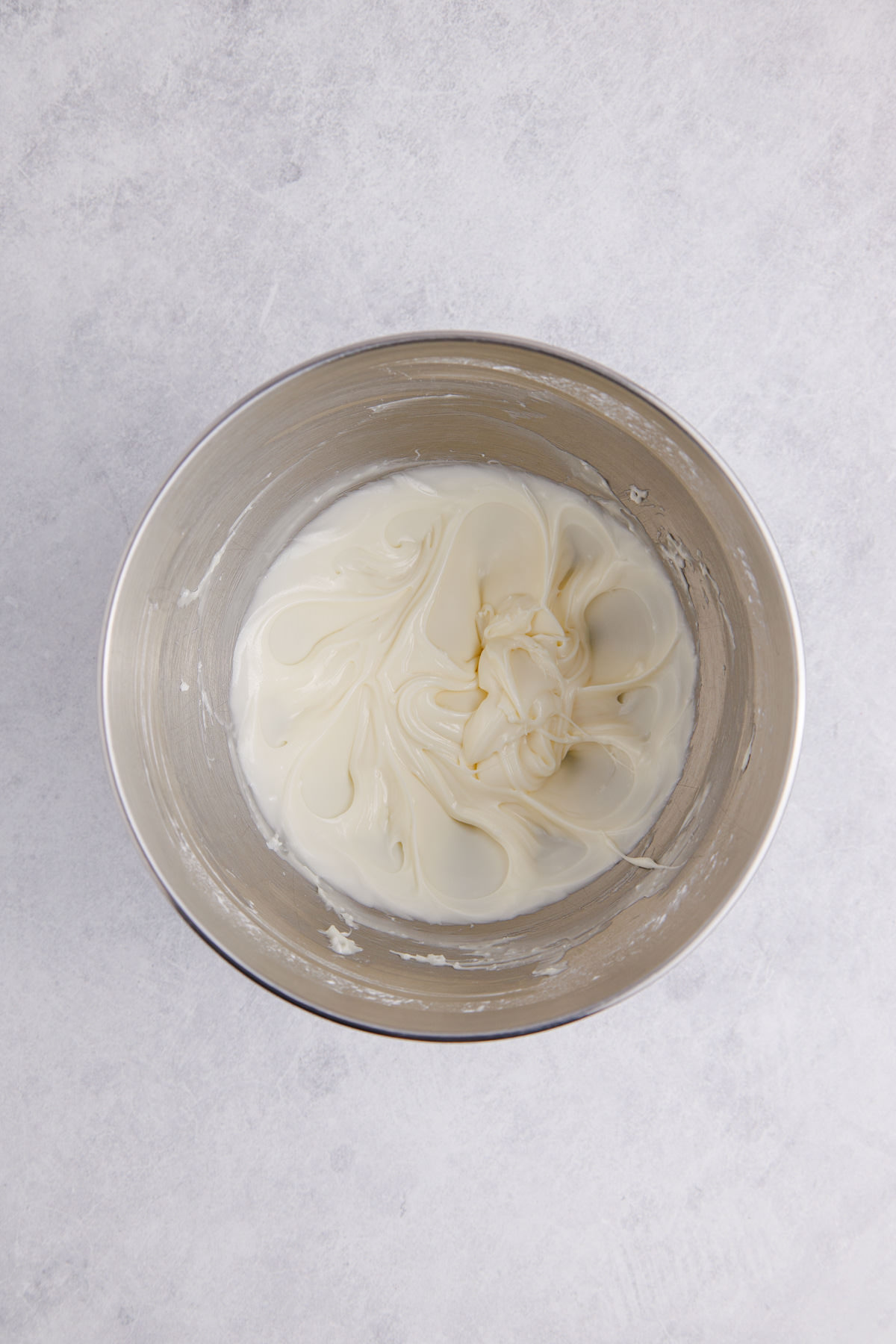 All of the icing ingredients combined in a bowl.