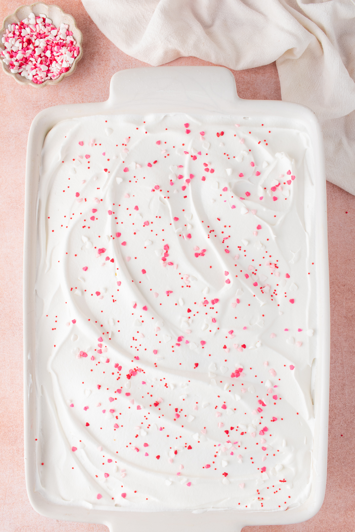 Cool Whip and sprinkles added on top of the cake.
