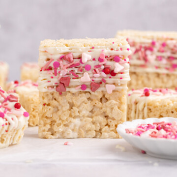 Valentine's rice krispie treats stacked on a table.