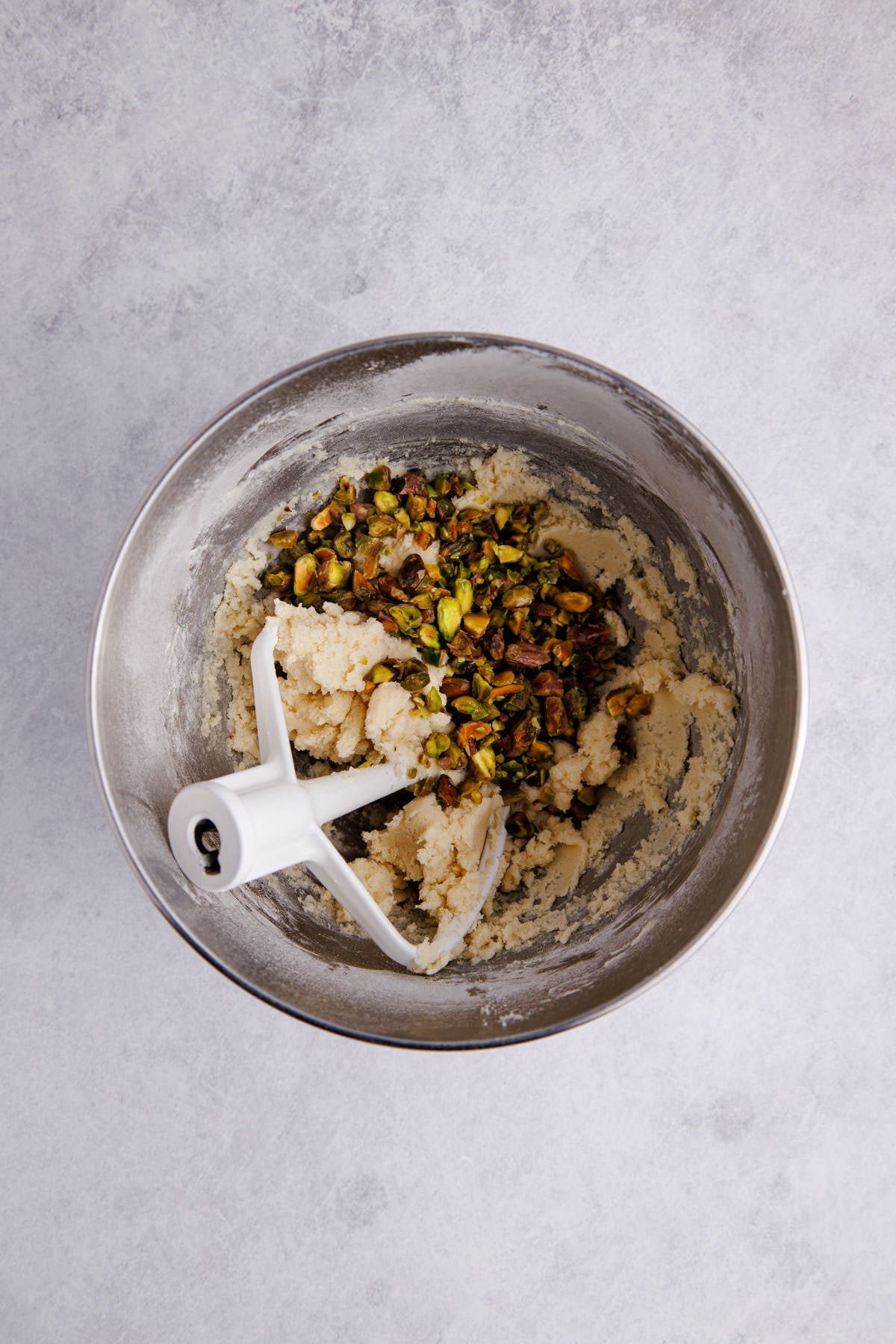 Butter, sugar, almond extract, flour, and salt in a bowl.