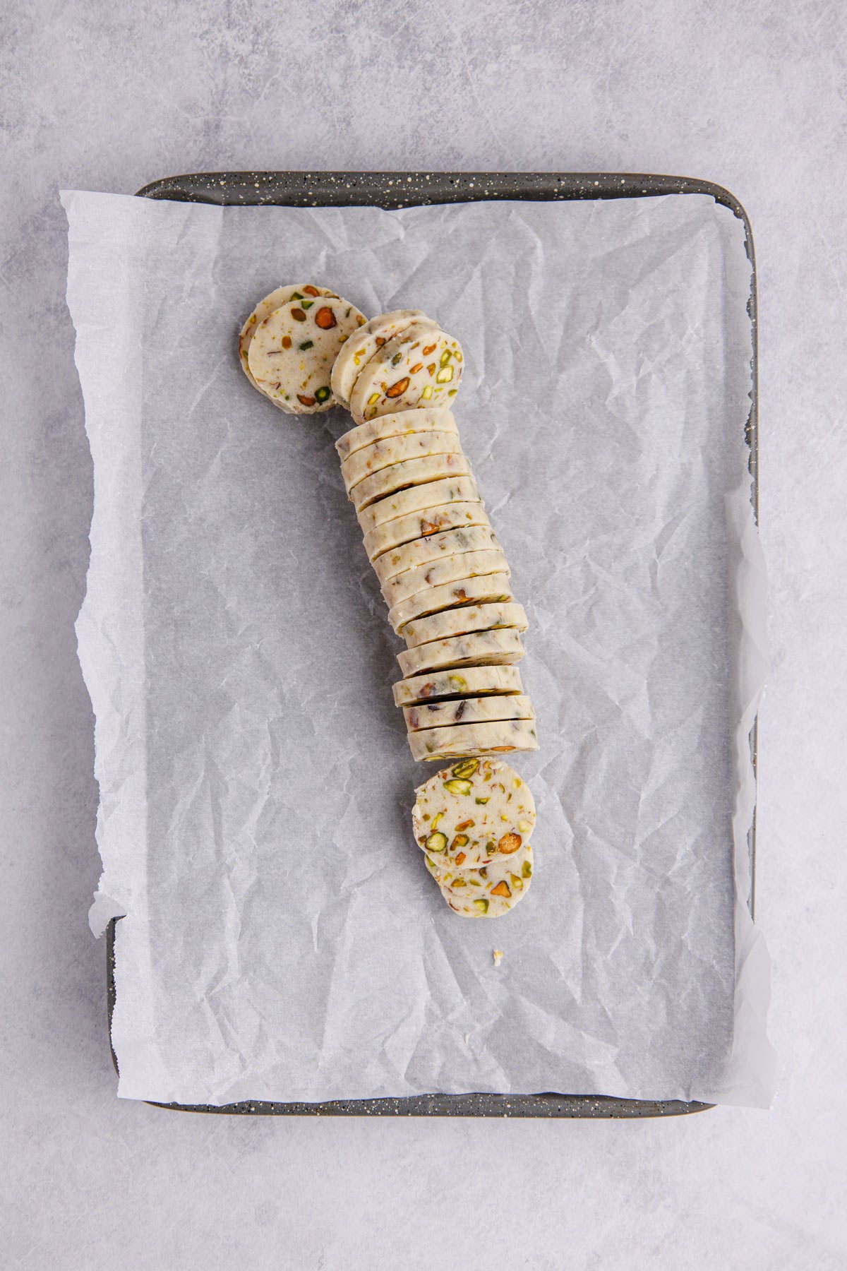 Dough sliced on parchment paper.