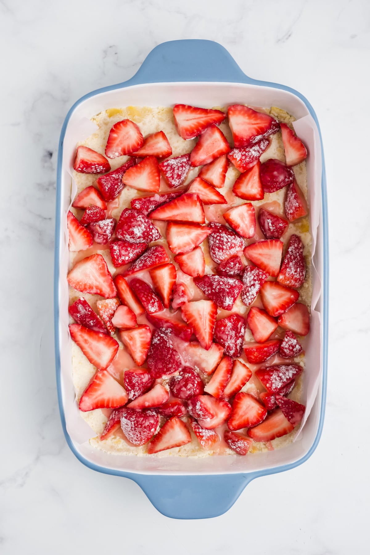 Strawberries with sugar added on top of the crust.