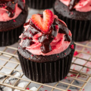 Strawberry chocolate cupcakes on a cooling rack.