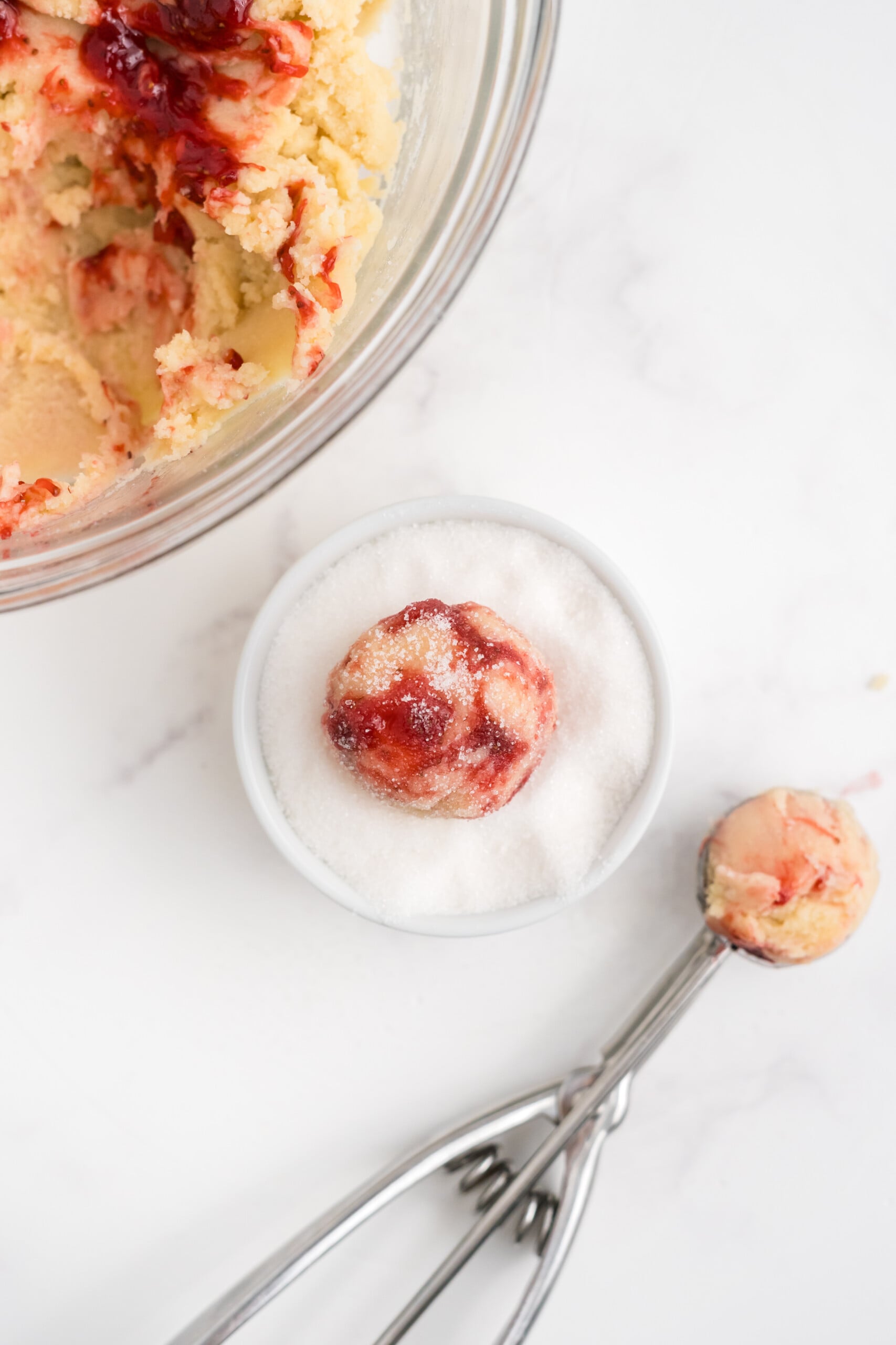 Tablespoon-sized balls scooped and rolled into sugar.