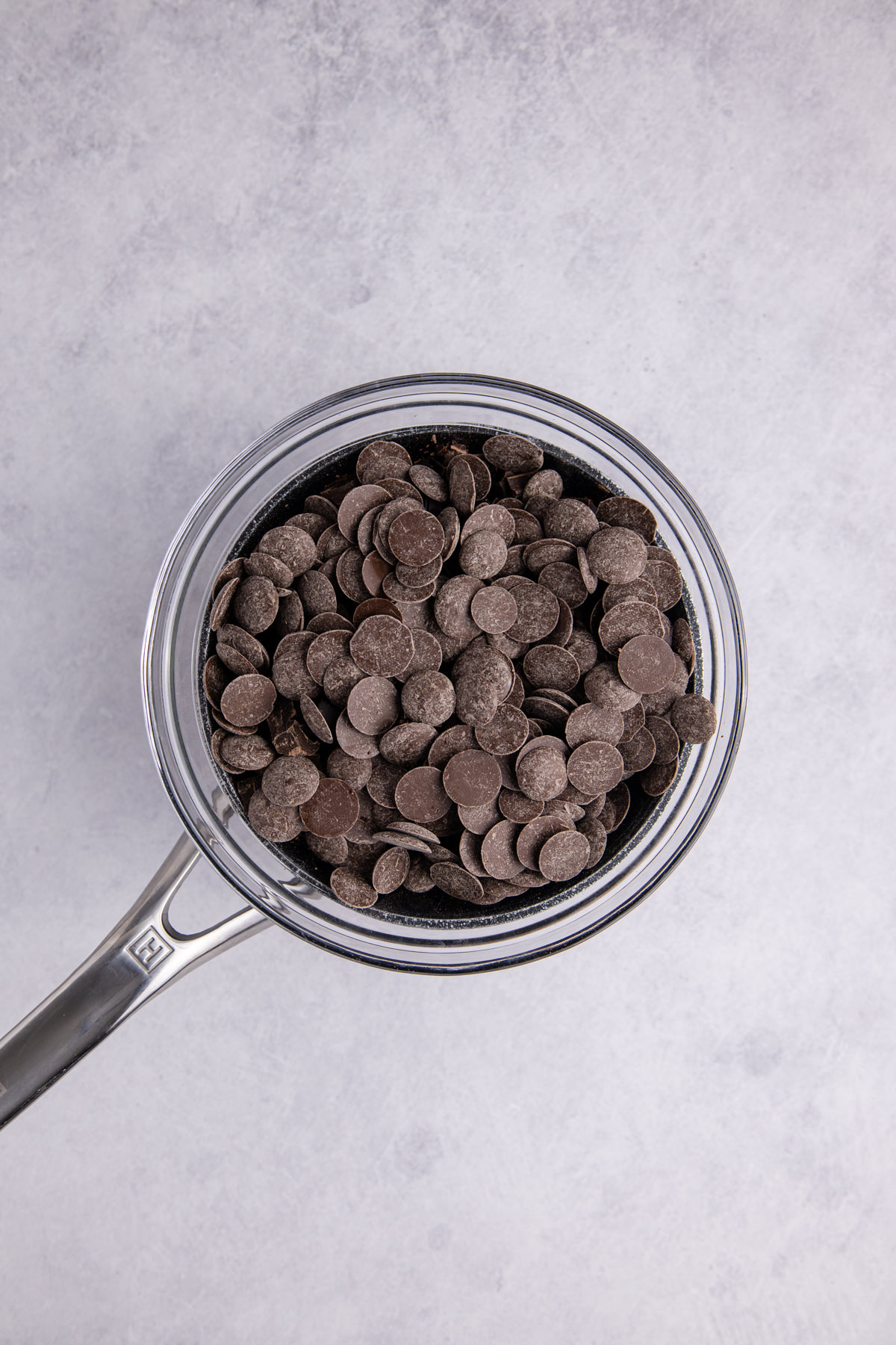 The semi-sweet and milk chocolate melting in bowls.