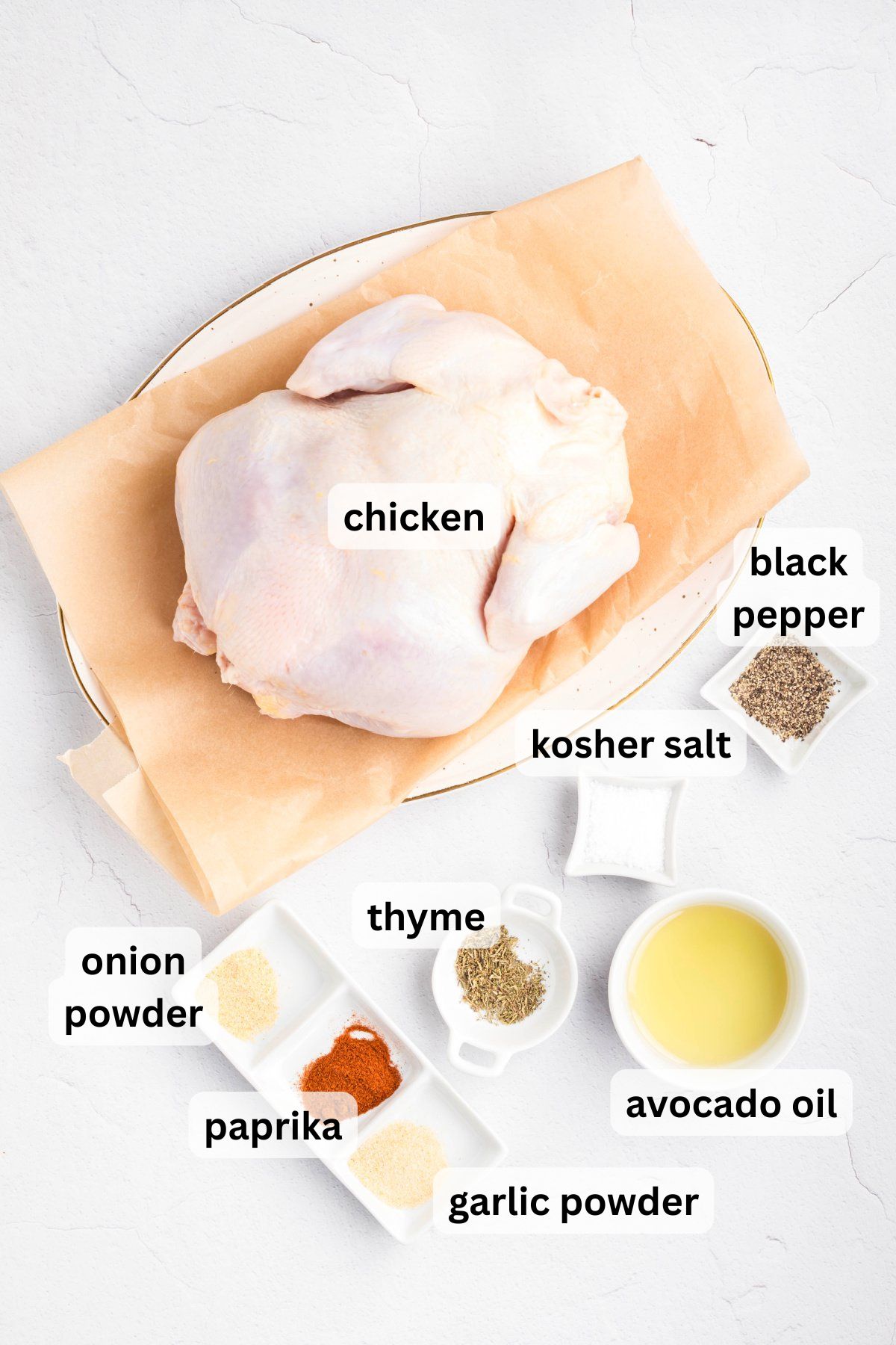 Ingredients to make this air fryer whole chicken on a table.