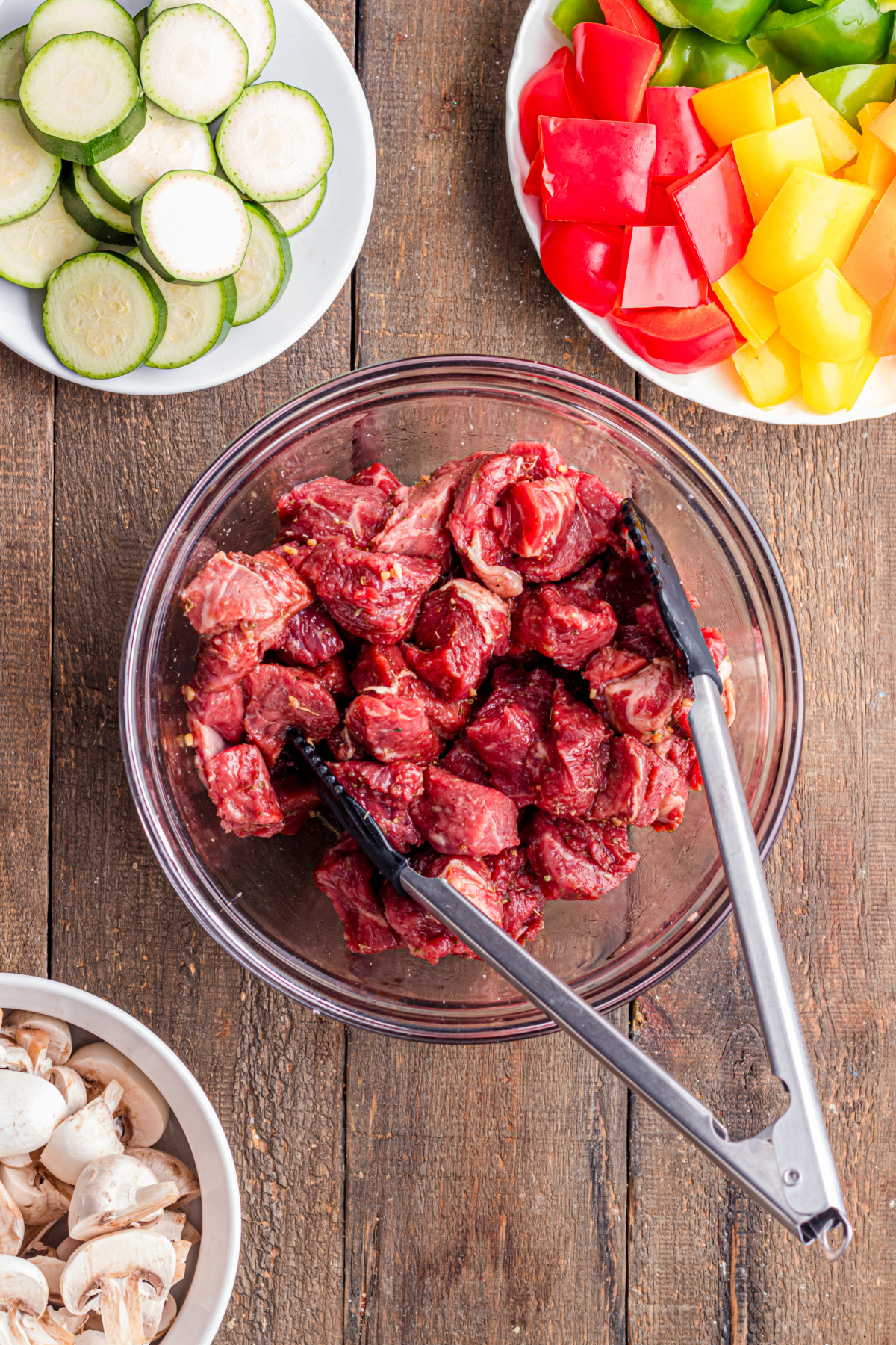 Meat being mixed with the marinade.