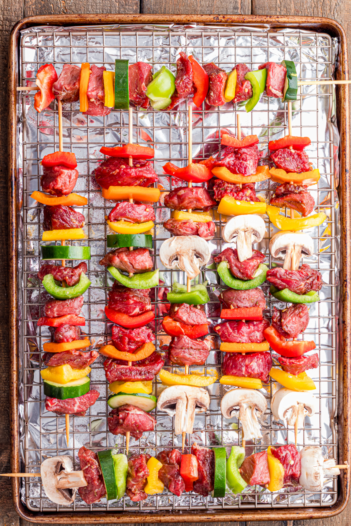 Marinated beef and vegetables skewered.