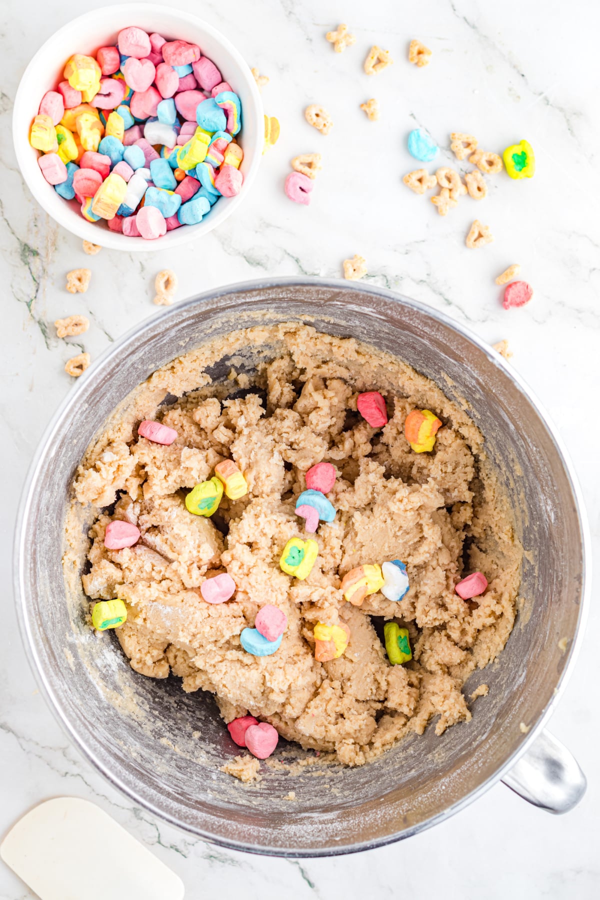 Marshmallows, butter, sugar, eggs and vanilla in a bowl.
