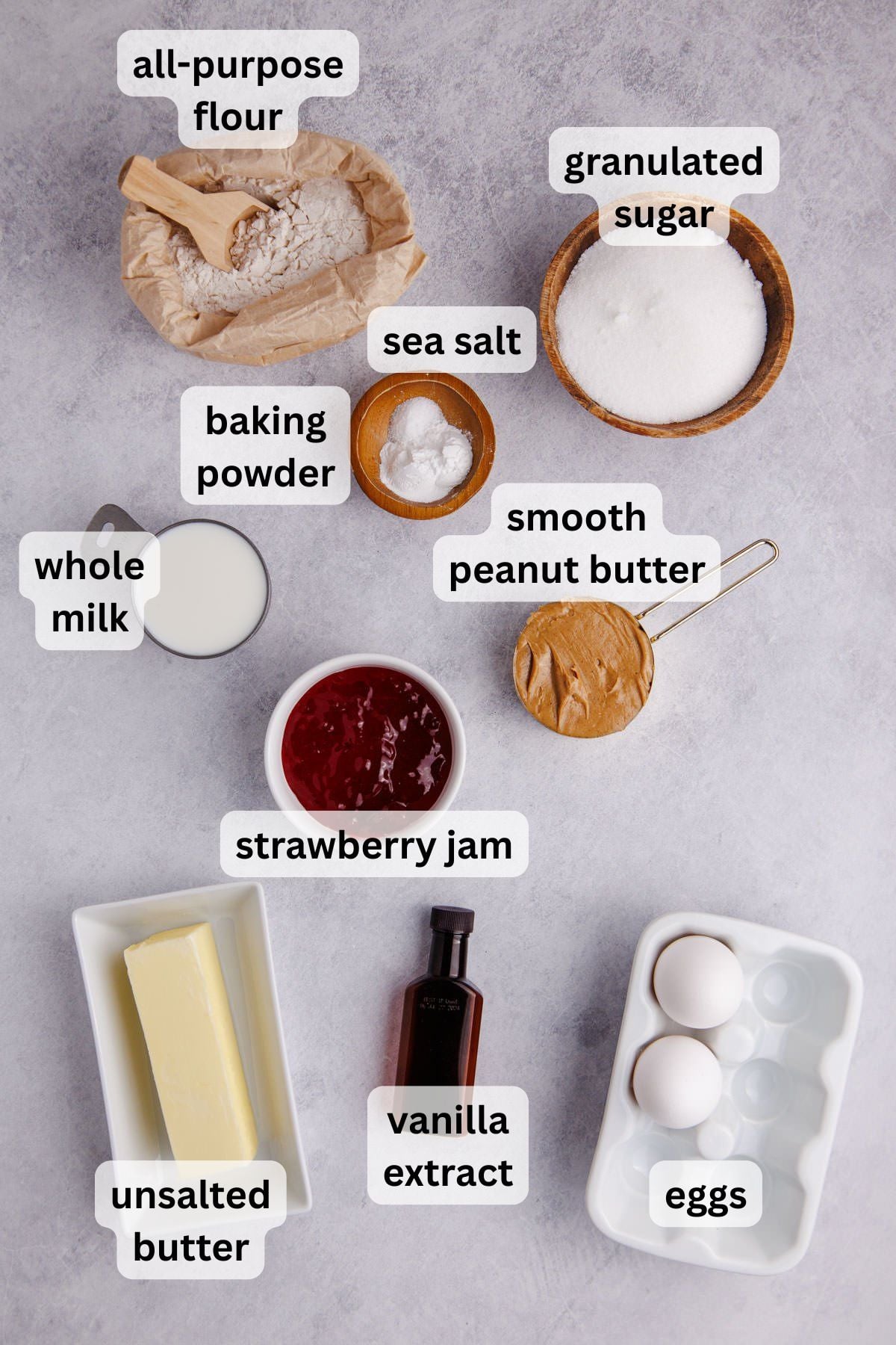 Ingredients to make these muffins in bowls on a table.