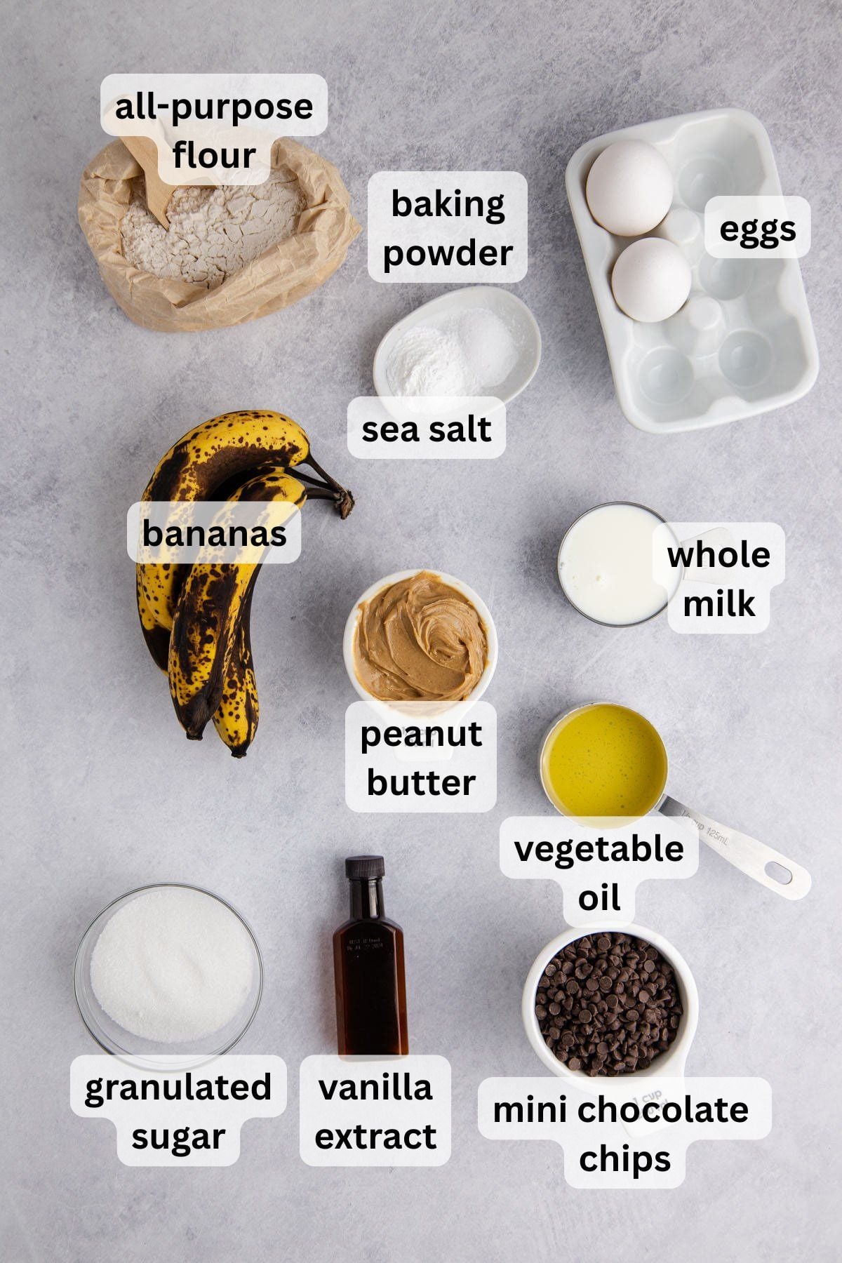 Ingredients to make banana peanut butter muffins on a table.