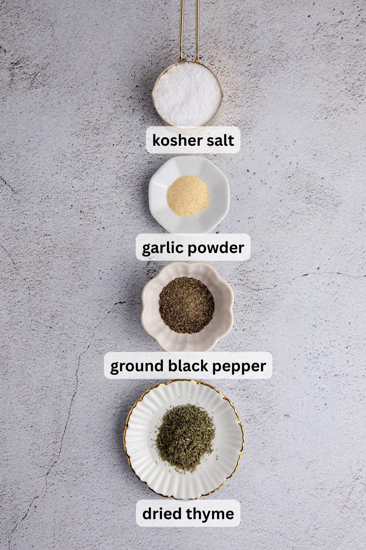 Ingredients to make this rub in bowls on a table.
