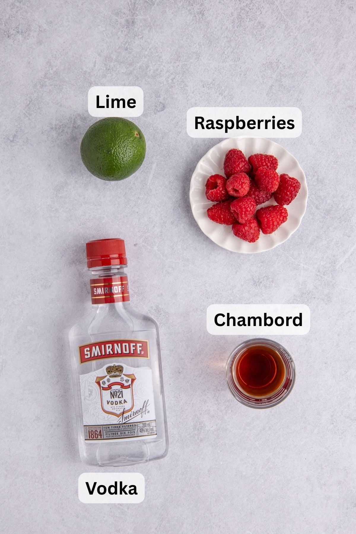 Ingredients for making a raspberry martini.