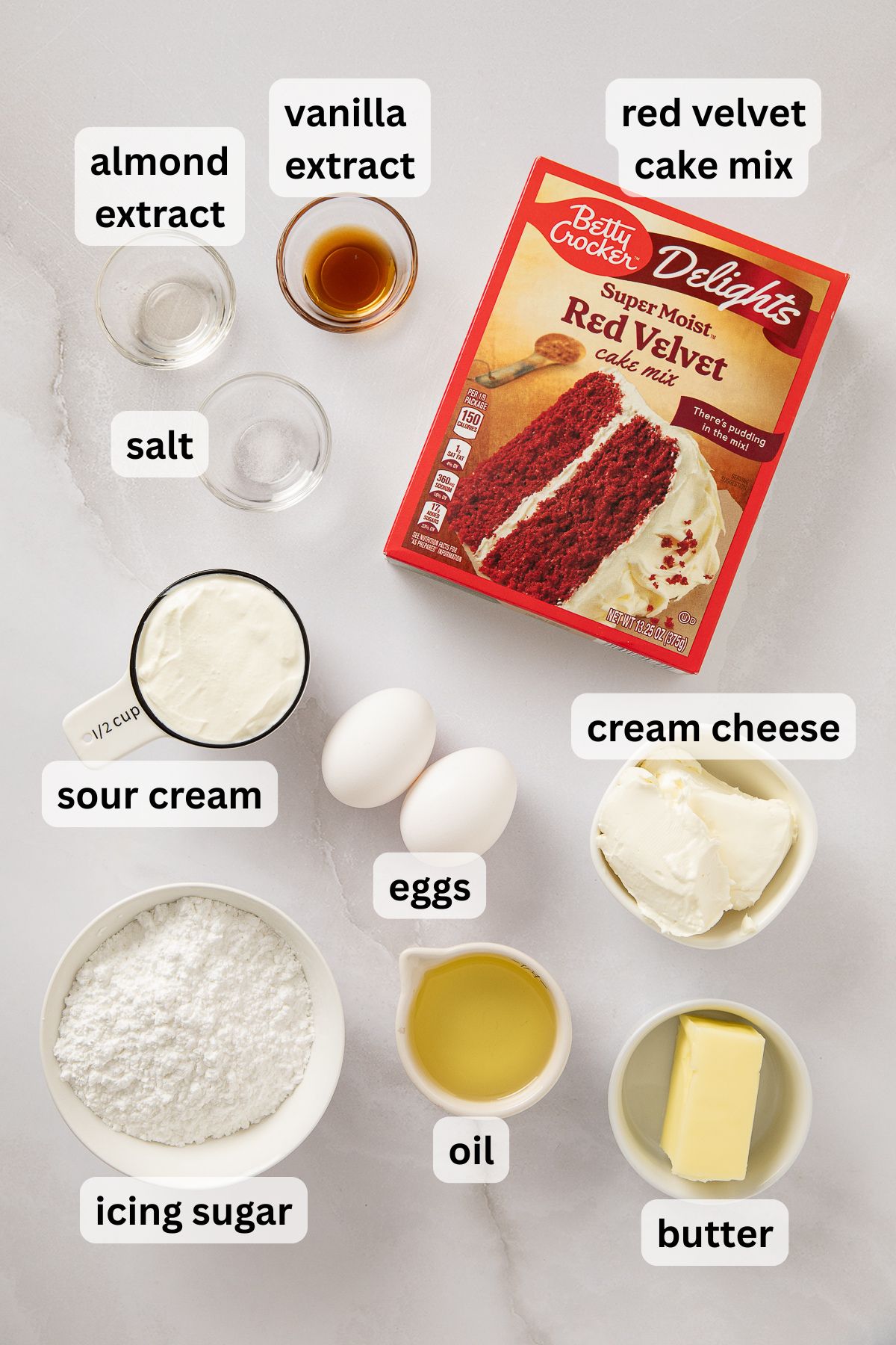 Ingredients for making red velvet cake mix cookies in bowls.