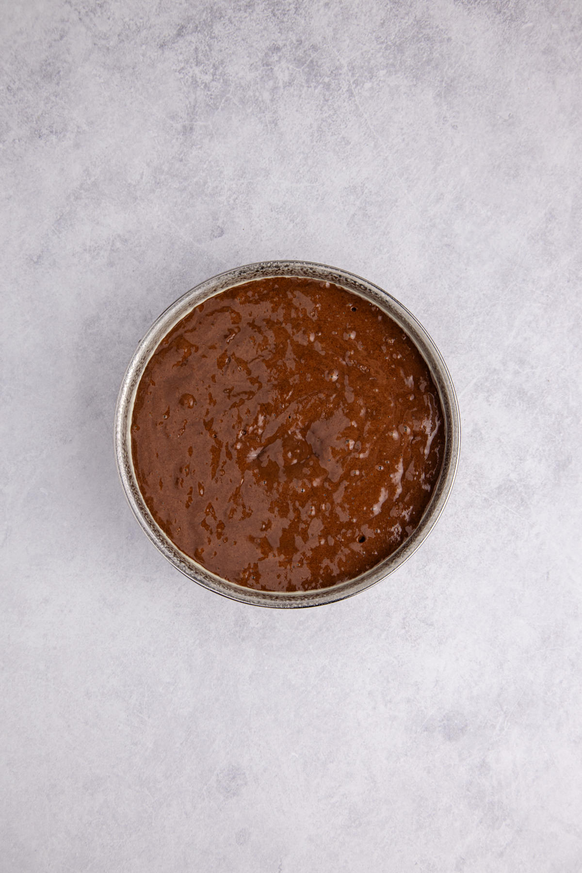 Cake batter poured into the prepared pan.