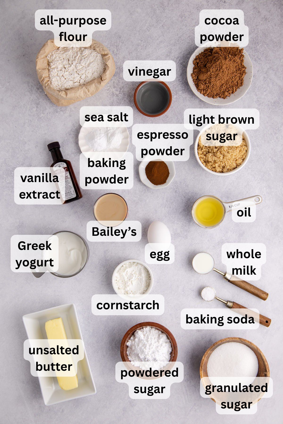 Ingredients to make this Bailey's Irish cream cake in bowls on a table.