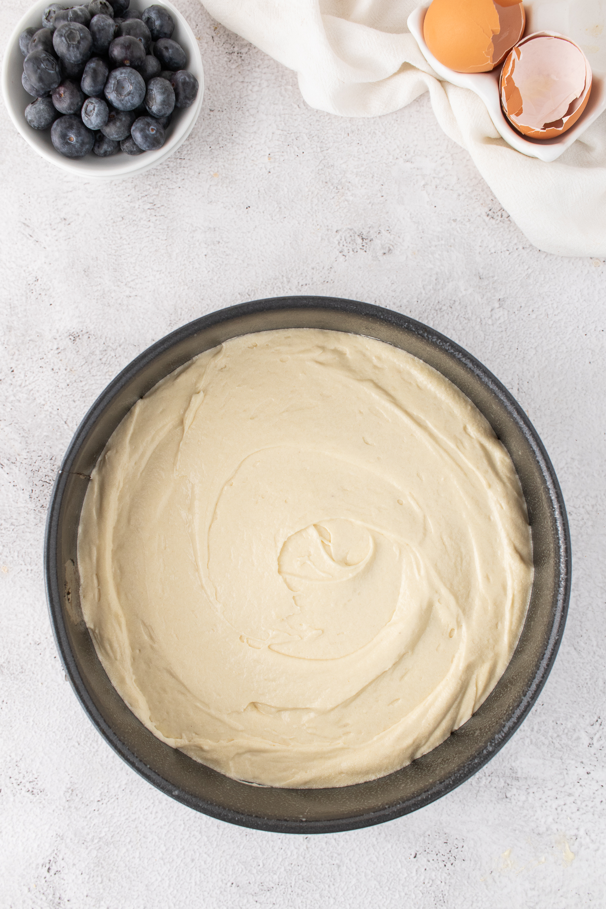 Wet ingredients and dry ingredients mixed together and spread on the prepared cake pan.