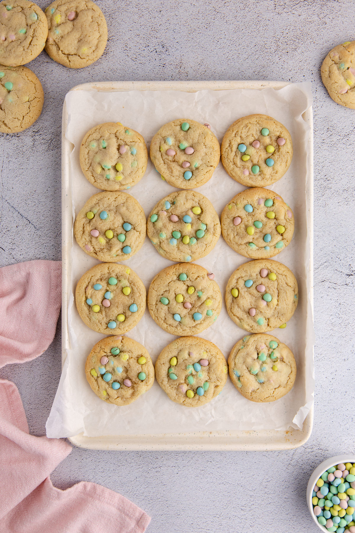 Cookies baked and cooling on a cookie sheet.