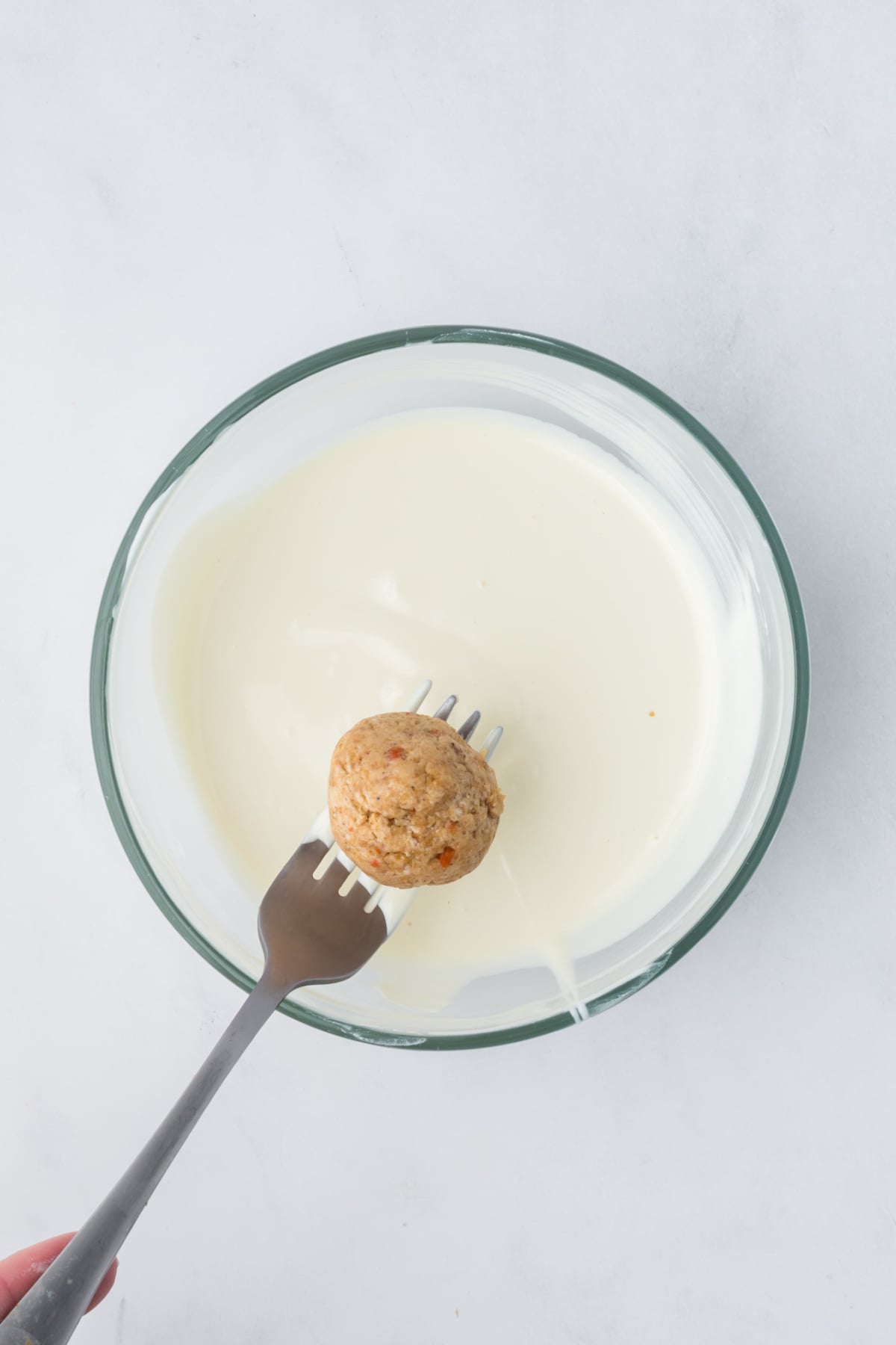 The carrot cake ball dipped in white chocolate.