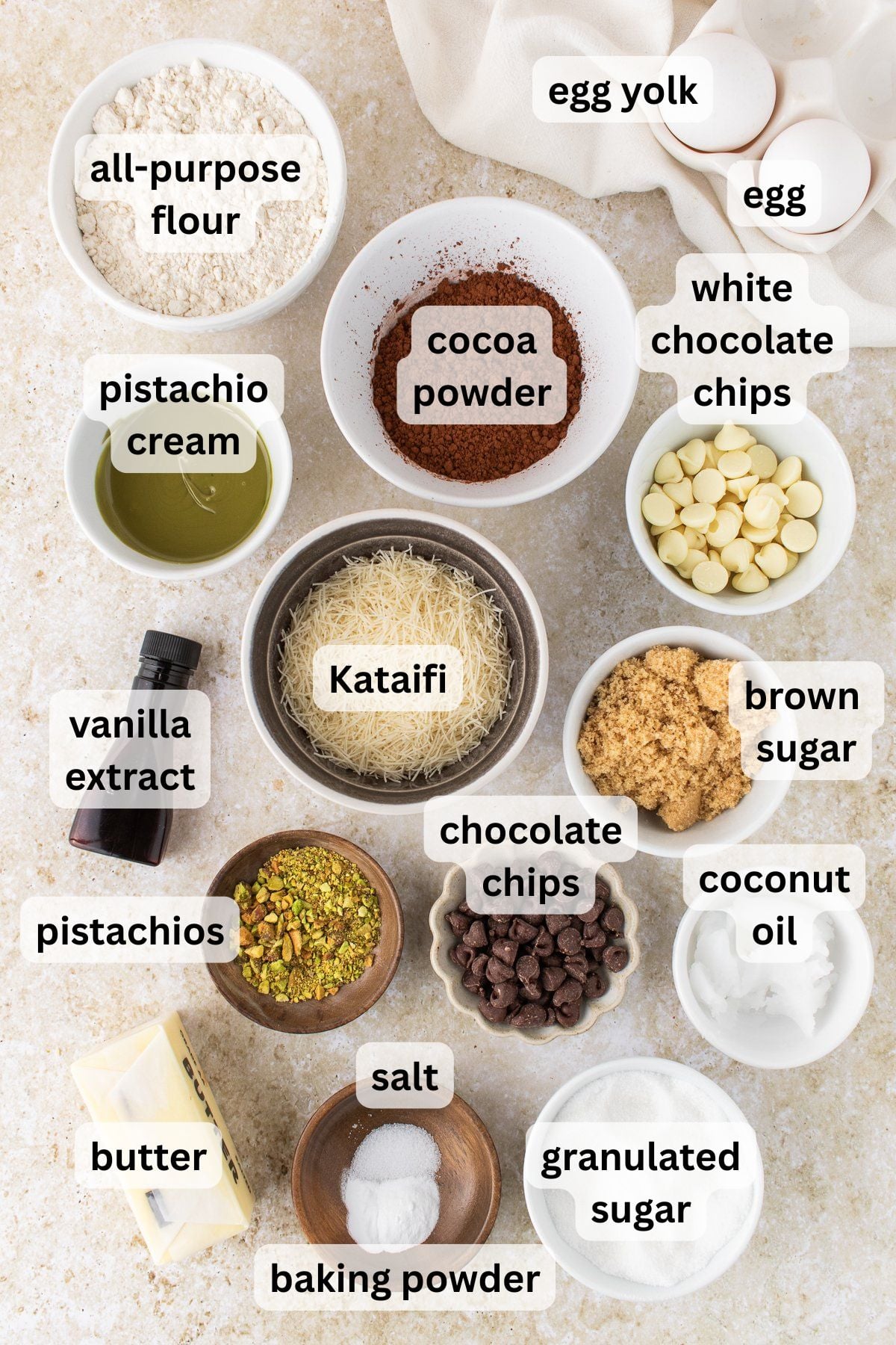 Ingredients to make these Dubai chocolate cookies in bowls on a table.