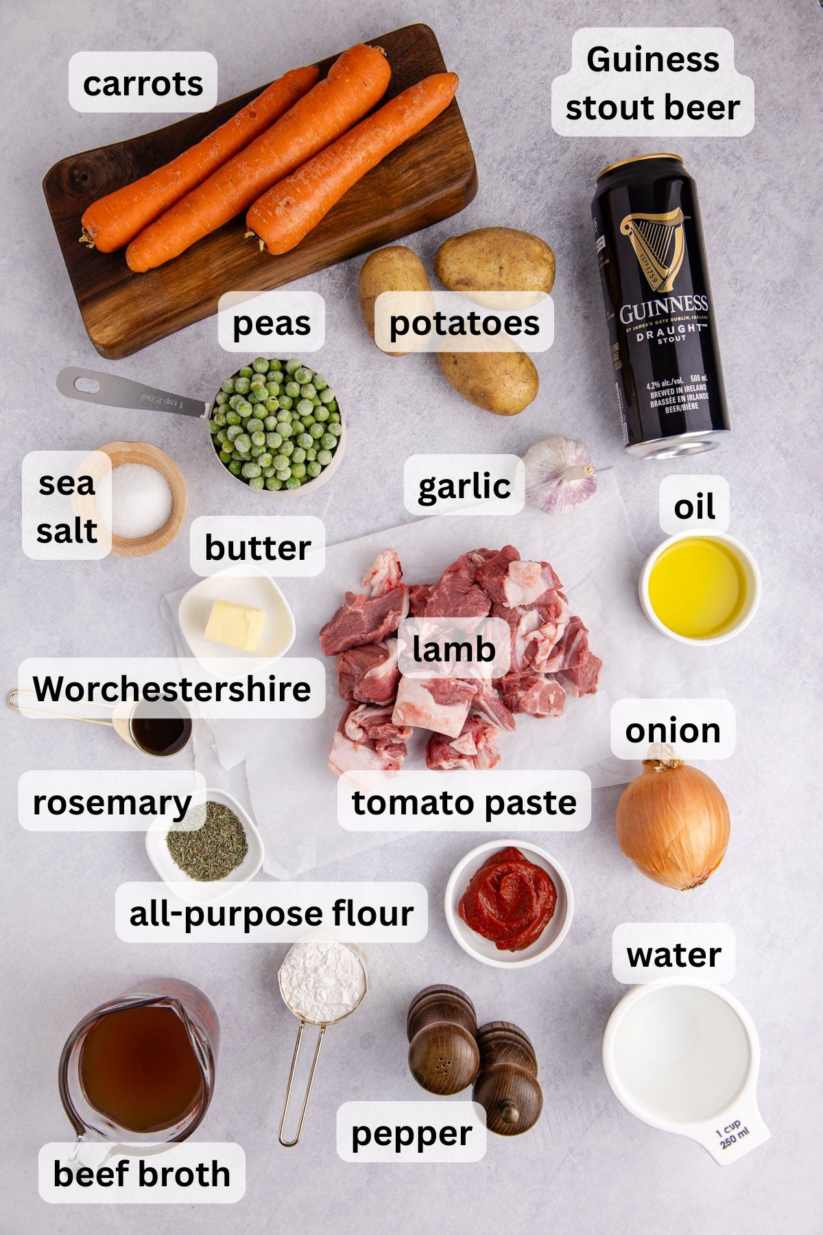 Ingredients to make this lamb stew on a table.