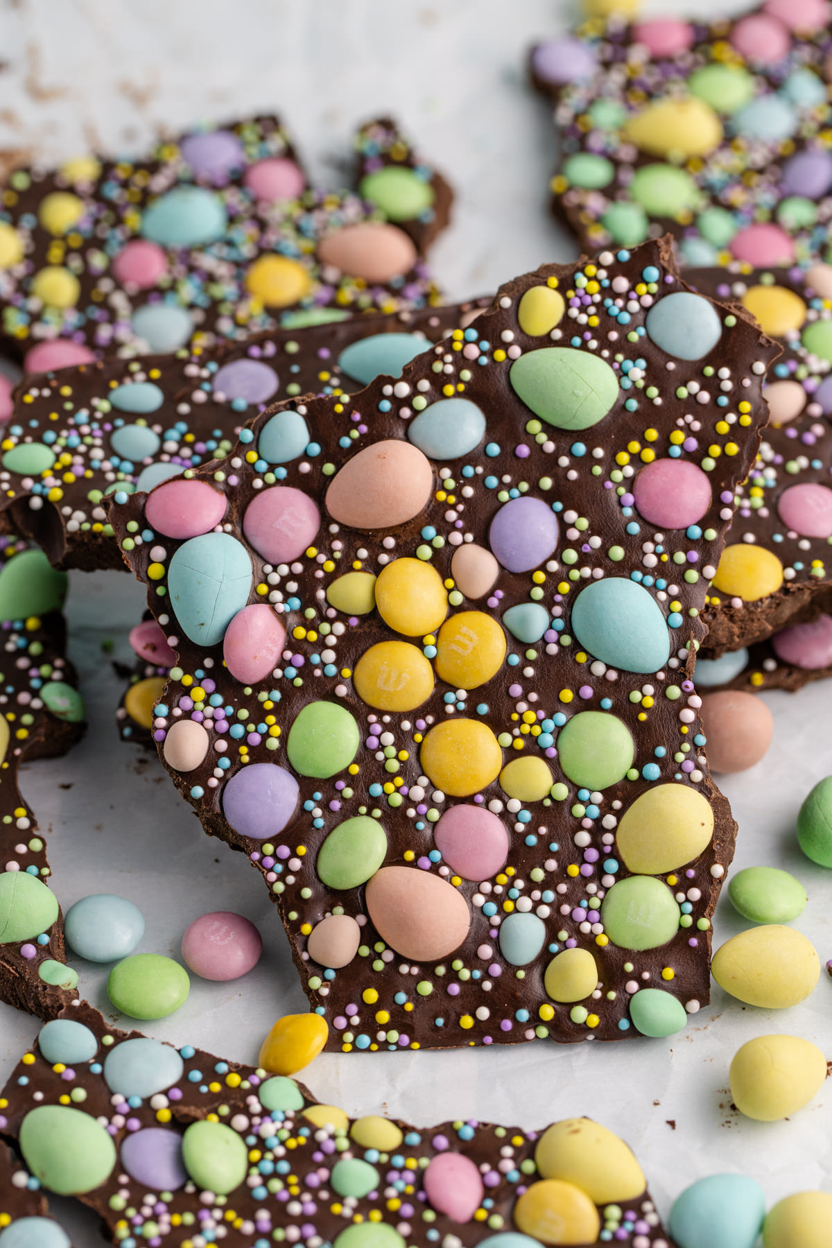 Chocolate bark with Easter candies on a table.