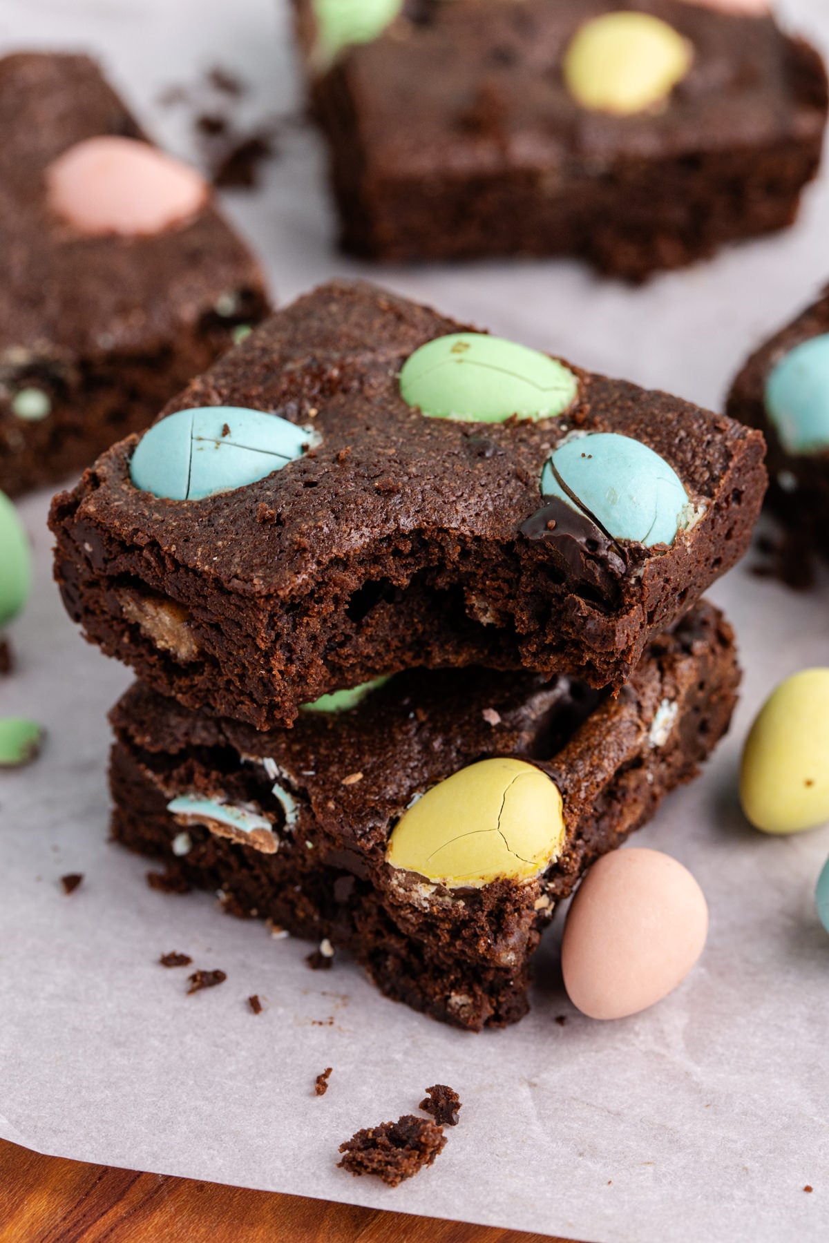 A stack of Easter brownies with a bite taken out of the top brownie.