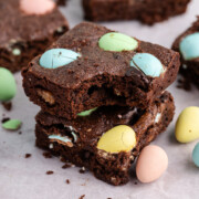 Easter brownies stacked on a table.