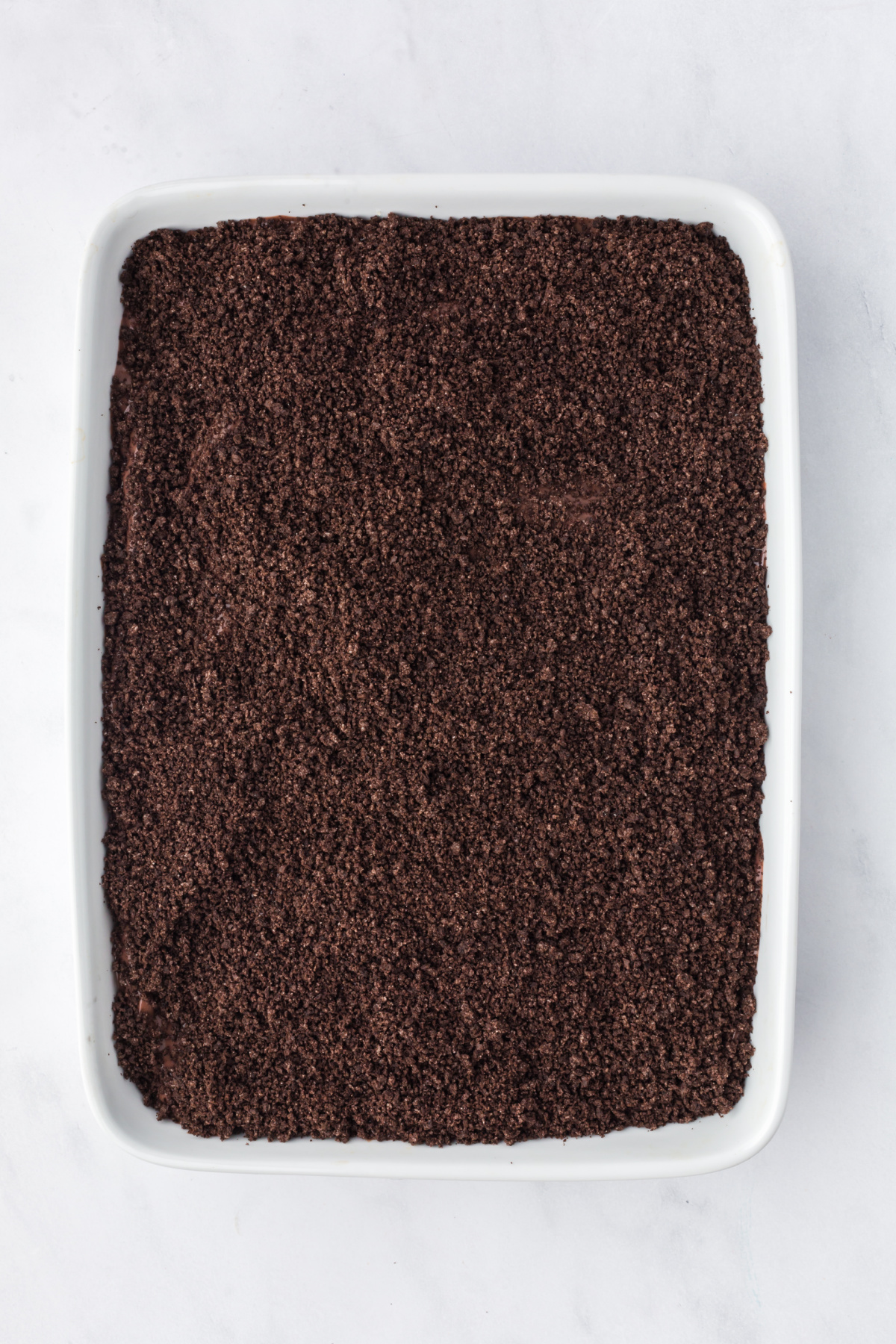 Oreo cookie crumbs layered over top of the pudding layer.