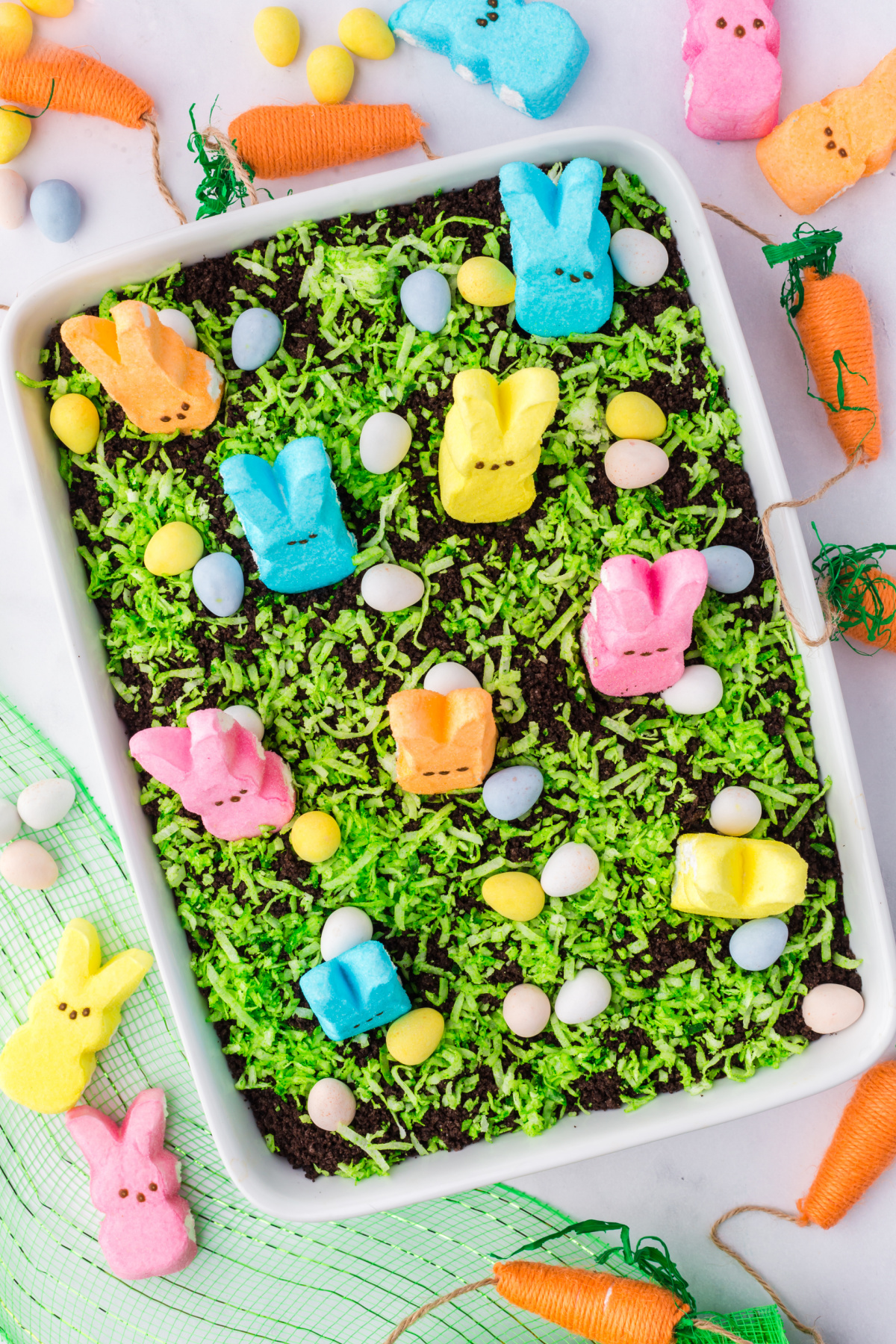 Peeps and eggs around the top of the cake for the decoration. 