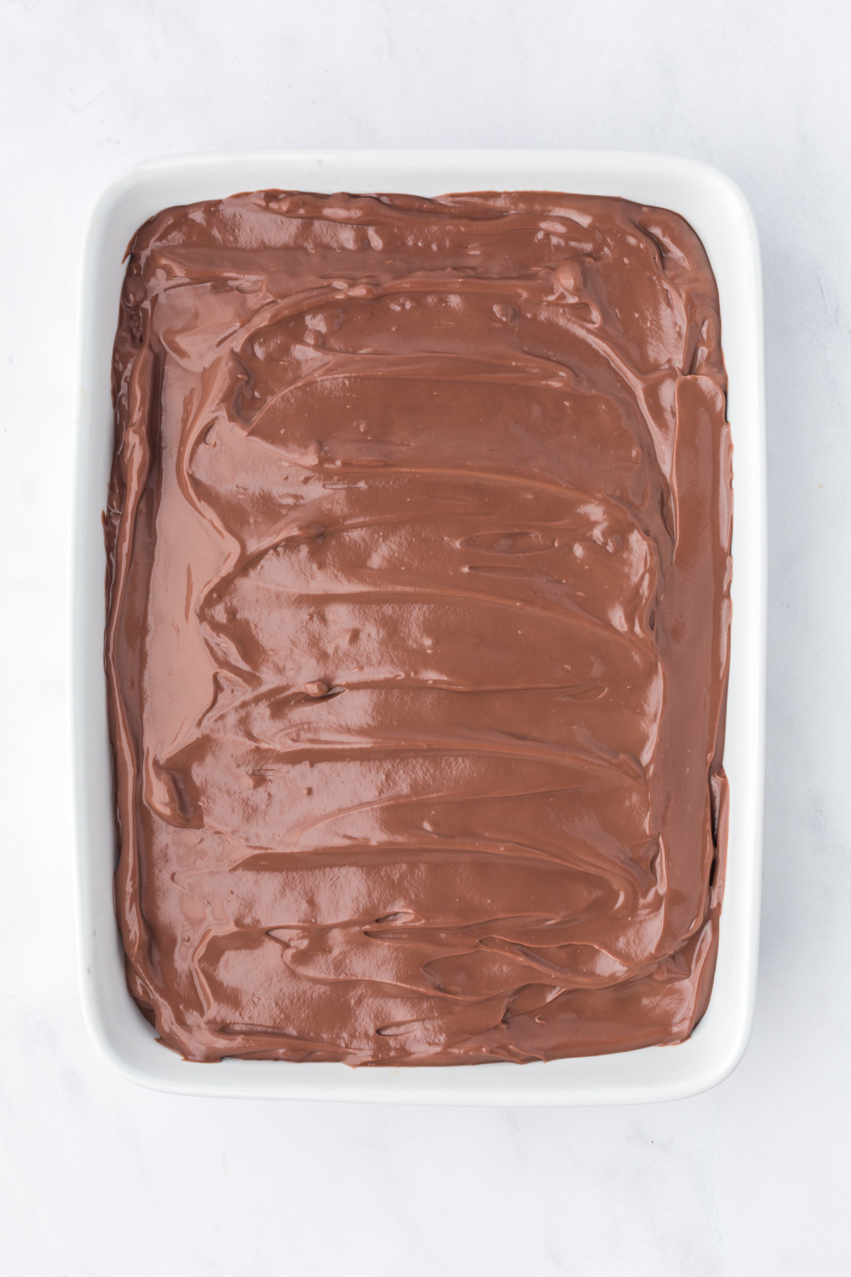 Pudding poured over top of the cake.