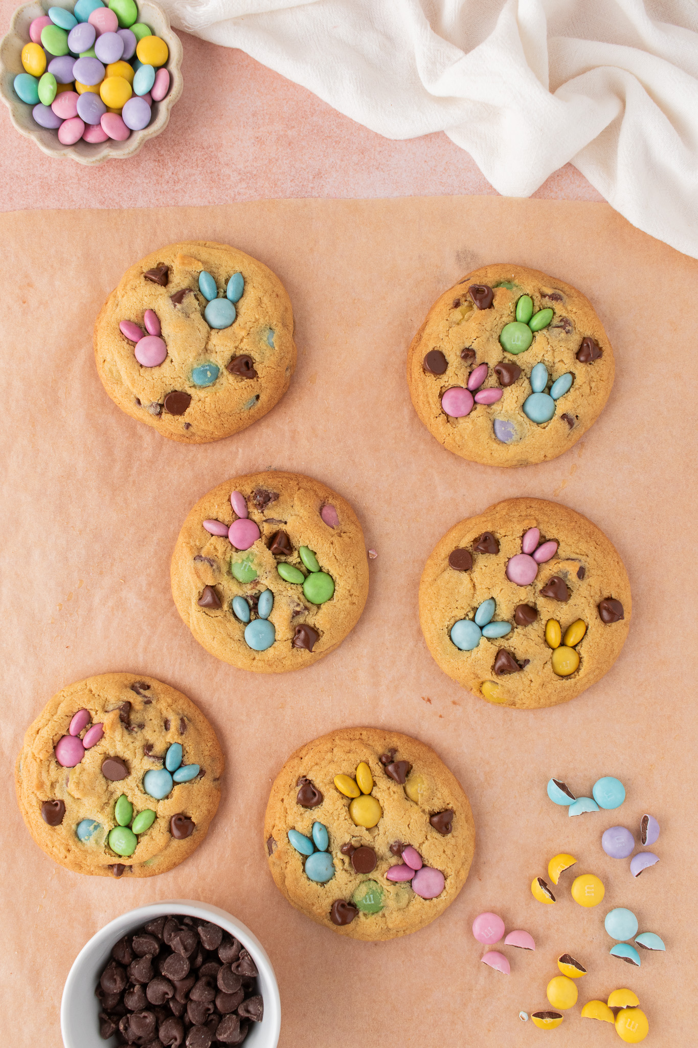 Whole pastel M&Ms used for the bunny faces and halves on top for the ears added to the cookie.