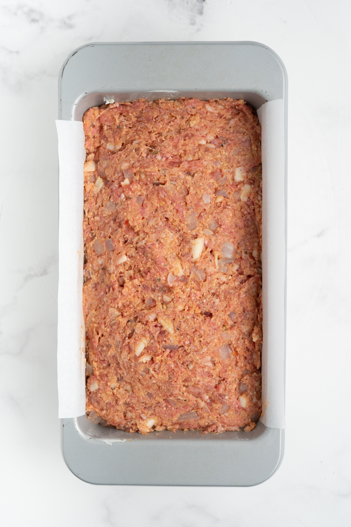 The meatloaf mixture transferred to a loaf pan.