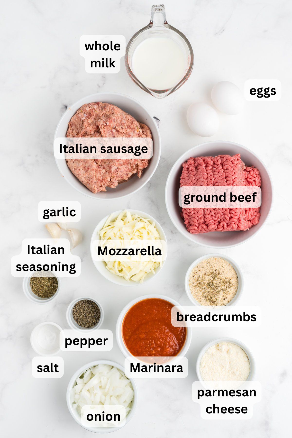 Ingredients to make this Italian meatloaf recipe in bowls on a table.